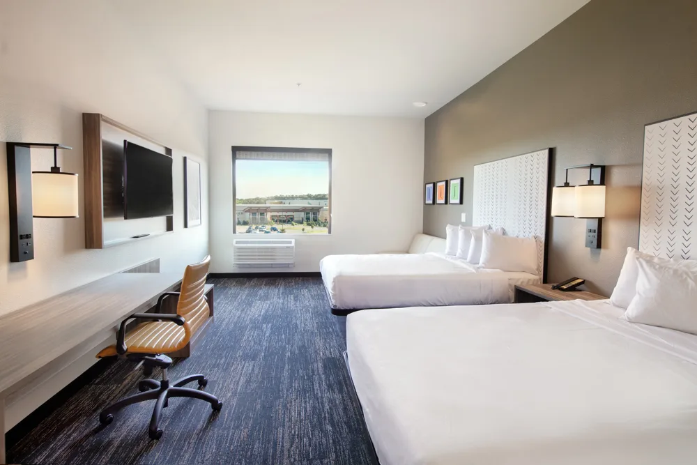 Two queen beds and a seating area in a Kalahari Hillside room