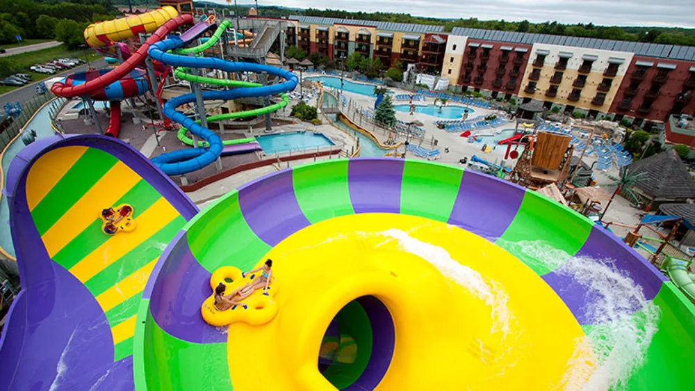 Riders on a colorful outdoor raft waterslide at Kalahari Wisconsin